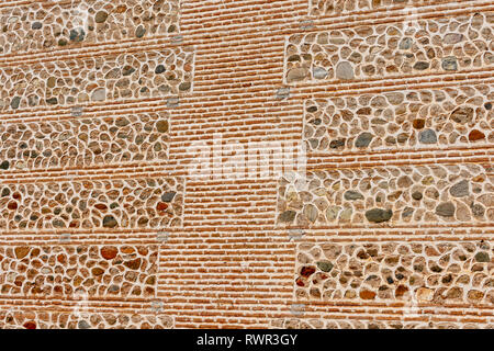Texture of restored stone and brick ancient wall Stock Photo