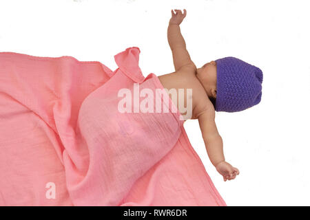 Infant in purple cap Stock Photo