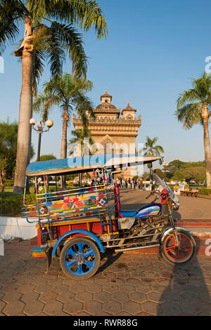 Tuk tuk at Patuxai Victory Monument Vientiane Laos Stock Photo