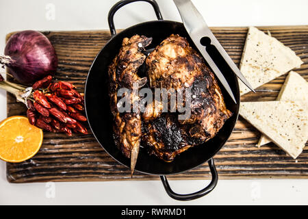 Barbecue pork spare ribs as top view on an old wood board Stock Photo