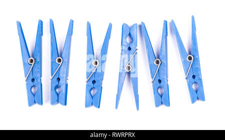 Blue plastic clothespins isolated on white background Stock Photo