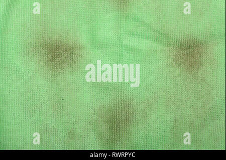 Texture of old dirty green fabric with stains close up Stock Photo