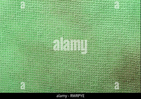 Texture of old dirty green fabric with stains close up Stock Photo