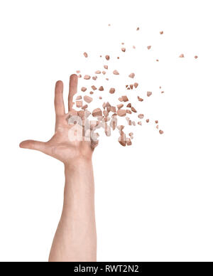 Close-up of man's hand with fingers and palm starting to dissolve into pieces isolated on white background. Stock Photo