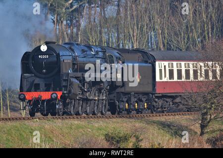 Black Prince, large black steam engine steaming through the countryside on a bright sunny day Stock Photo