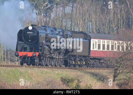 Black Prince, large black steam engine steaming through the countryside on a bright sunny day Stock Photo