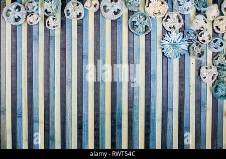 Background composition on wood in shades of light blue and blue with a matching potpourri contour Stock Photo