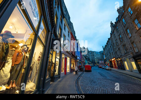 Dusk view of historic buildings and shops on Victoria Street in Edinburgh Old town, Scotland, UK Stock Photo