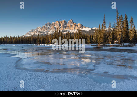 Castle Mountain in winter at sunset with frozen Bow River, Banff National Park, Canada, Canadian Rockies