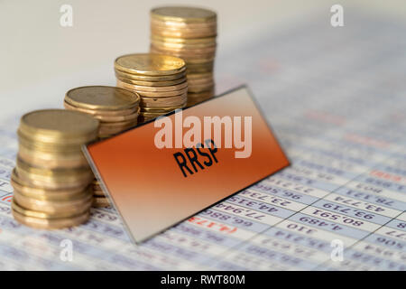 Stacks of coins on spreadsheet showing Growth in RRSP Savings Stock Photo