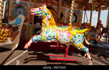 Painted horse on a carousel on the Brighton Palace pier,  in the coastal town of Brighton, Sussex, England. Stock Photo