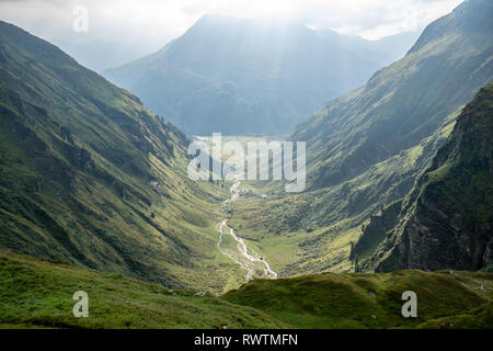 Sunrays are breaking through the clouds in the morning after the rain in the moutains of Gastein, Austria Stock Photo