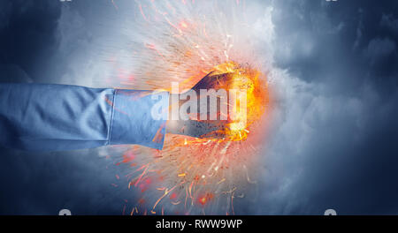 Hand hits strongly and makes fire beam around  Stock Photo