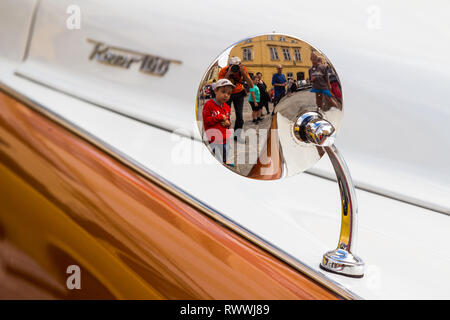Detail of vintage Rover 100 at car show in Sopron, Hungary. People refleced in the rear side of rearview mirror. Stock Photo
