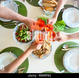 Friends clinking glasses with rose wine at Christmas, square crop stock  photo (222245) - YouWorkForThem