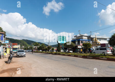 KALAW, MYANMAR - 25 NOVEMBER, 2018: Horizontal picture of cars in large avenue of Kalaw during blue sky day, Myanmar