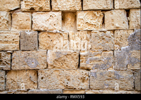 wall of old limestone blocks, exterior. Stock Photo