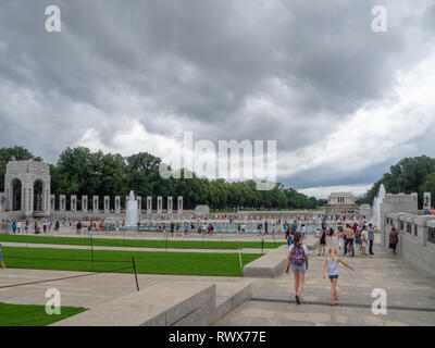 Washington DC, District of Columbia, Summer 2018 [United States US, World War II Memorial, park with Reflecting Pool, falling dusk, dark cloudy sky be Stock Photo