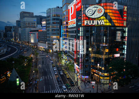 The Ginza district at night. Ginza is a popular upscale shopping area of Tokyo Stock Photo