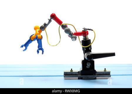 Toy Robotic Arm on White Background Stock Photo