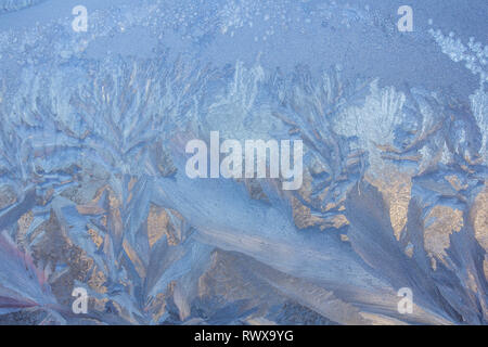 frost painted a picture on the window. winter magic. winter frost. drawing on the window. Stock Photo