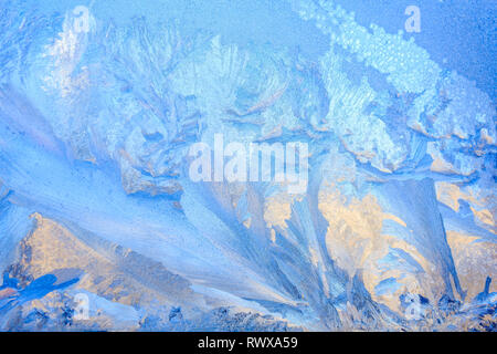 frost painted a picture on the window. winter magic. winter frost. drawing on the window. Stock Photo