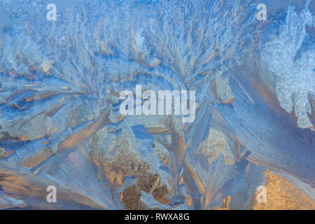 frost painted a picture on the window. winter magic. winter frost. drawing on the window. Stock Photo