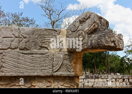 The head of Mayan carved stone snake with geometric ornamentation on its body from Chechen Itza Stock Photo