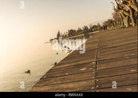 Flying seagull over Garda lake Stock Photo
