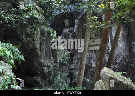 Ancient buddhist statues carved in the rock (Lingyin temple in Hangzhou, China) Stock Photo