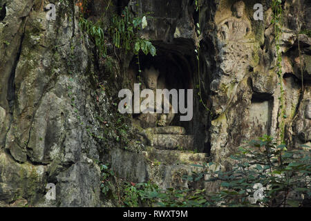 Ancient buddhist statues carved in the rock (Lingyin temple in Hangzhou, China) Stock Photo