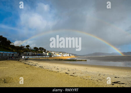 Lyme Regis, Dorset, UK. 7th April 2026. UK Weather. Sunbathers on the ...
