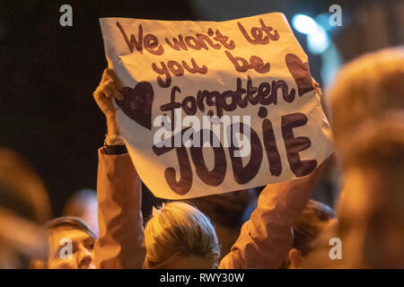 Romford, London, UK. 7th March, 2019. . a large peaceful protest of over two thousand people marched through the centre of Romford to Romford Police station protesting against the murder of Jodie Chesney and against knife crime. A delegation met with senior officers at Romford police station. Many of the crowd wore purple ribbons as a mark of respect. During the march and outside the police station there were chants of 'no more knifes' and 'stop and search' The protest ended with a minute silence. Credit: Ian Davidson/Alamy Live News Stock Photo