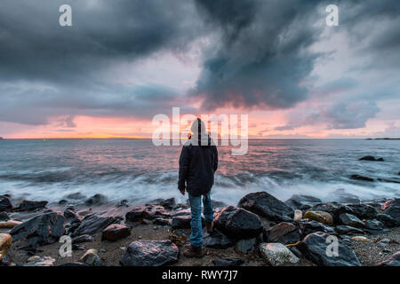 Mousehole, Cornwall, UK. 8th March 2019. UK Weather.  There was a fiery sunrise at Mousehole this morning, with a brief shower of rain before the sun came up. Credit: Simon Maycock/Alamy Live News Stock Photo