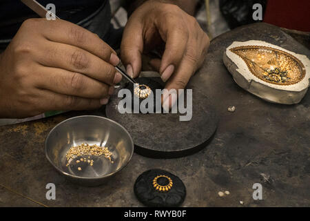 (190308) -- KOLKATA, March 8, 2019 (Xinhua) -- A worker makes gold jewellery at a workshop in Kolkata, India, March 8, 2019. Indian jewellery industry plays an important role in the economy, accounting for 7 percent of GDP and 14 percent of merchandise exports and provides direct employment to 5 million people. (Xinhua/Tumpa Mondal) Stock Photo