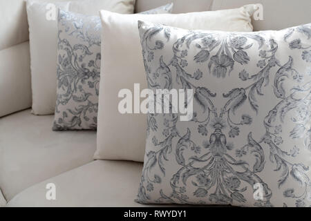 A several pillow on the light sofa Stock Photo