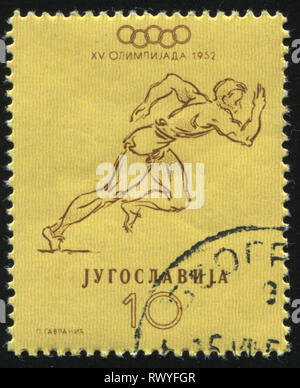 RUSSIA KALININGRAD, 12 NOVEMBER 2016: stamp printed by Yugoslavia, shows runner, circa 1952 Stock Photo