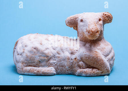 Traditional austrian easter lamb cake on a blue background. Stock Photo
