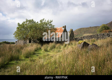 An abandoned croft in fields near the village of Lochbie on the Hebridean Island of Mull. Stock Photo