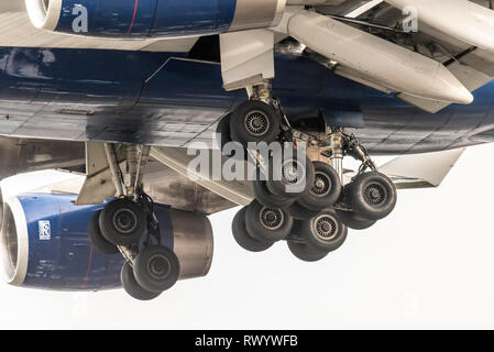 Undercarriage of British Airways Boeing 747 Jumbo Jet landing at London Heathrow Airport, UK. Wheels, tyres, tires, legs and doors, mechanism Stock Photo