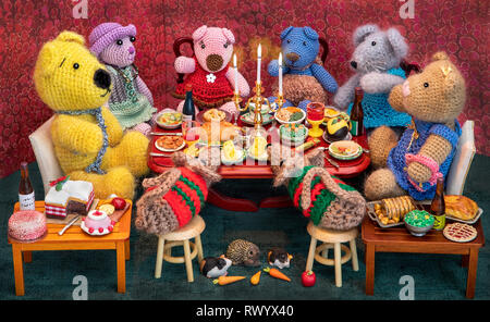 Miniture crochet models (with Release)  sitting down for a slap-up dinner, taken for Christmas cards or Children's books. Stock Photo