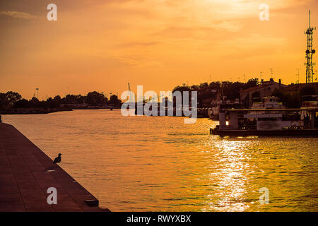 Sunset in Lido port.Italy Stock Photo