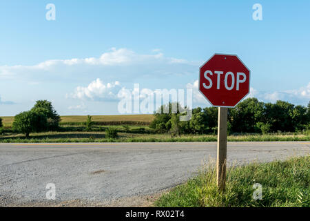 Rural stop sign on a dirt road. Stock Photo