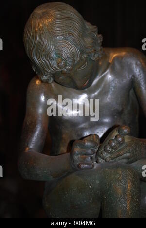 boy with thorn, also called Fedele (Fedelino) or Spinario, roman bronze statue in Palazzo dei Conservatori, Capitoline museum Stock Photo