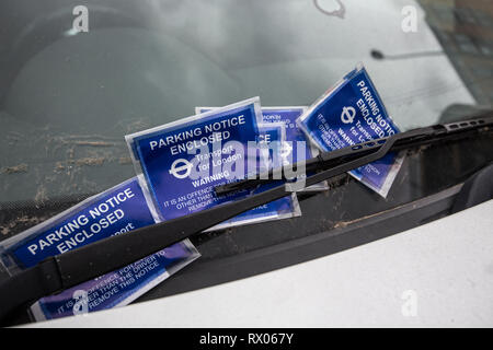 Parking Penalty Charge Notices placed on a drivers windscreen, London, England, UK Stock Photo