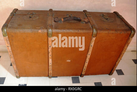 Old Leather Brown Suitcase on mosaic tile Stock Photo