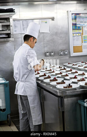 MIAMI, FLORIDA - March 2, 2016: Kitchen staff on cruise ships, including chefs and cooks, work some of the hardest and longest hours as the kitchens a Stock Photo