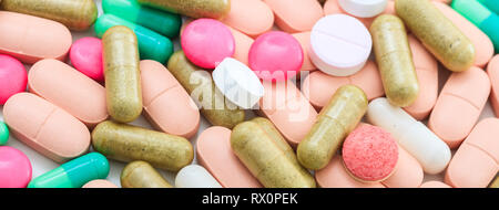 Medicine, medication. Colorful pills and capsules background, banner, closeup top view