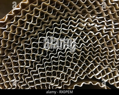 corrugated cardboard for packing. abstract background horizontal lines with wavy lines of beige color Stock Photo