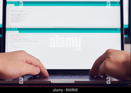 Programmer hands making computer code front view Stock Photo